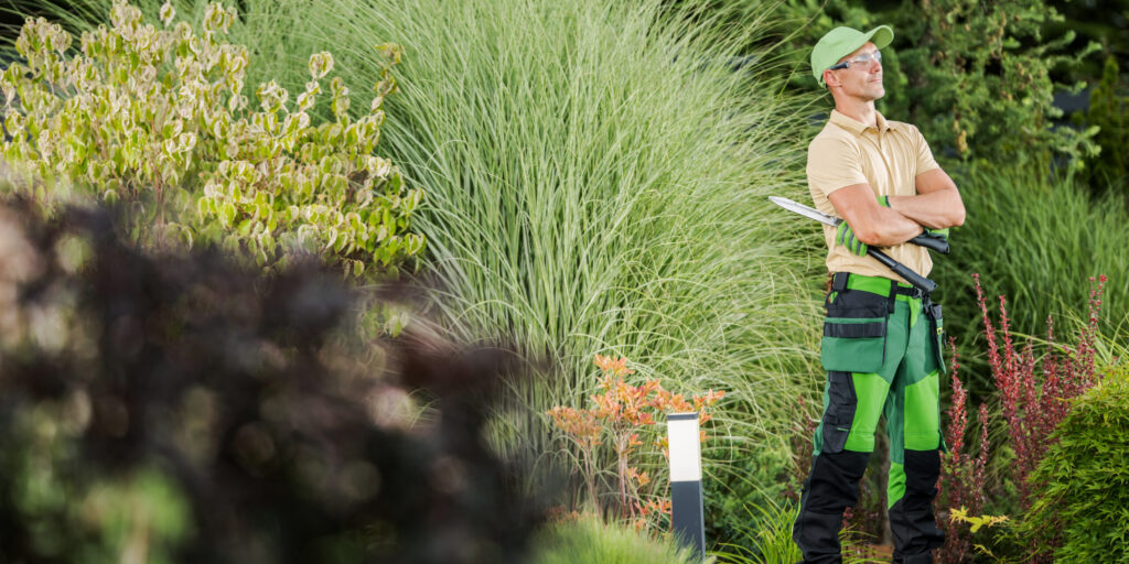 Professional Garden Worker with Pro Scissors in His Hands